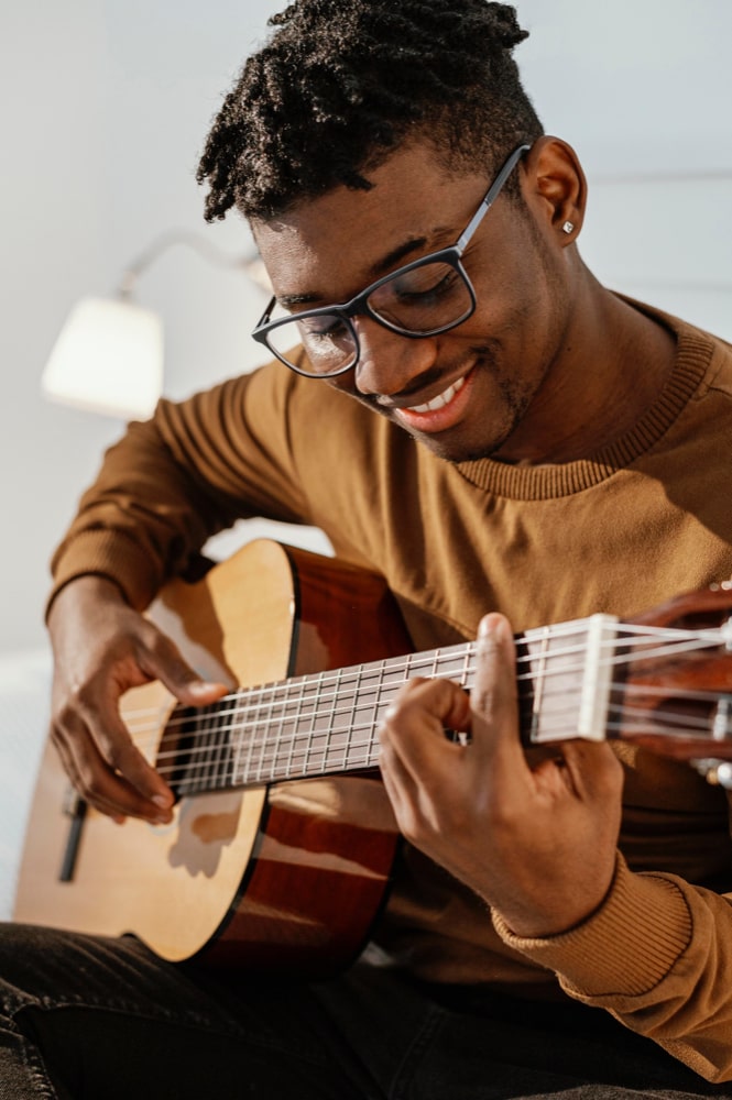 Student enjoying Guitar Lesson